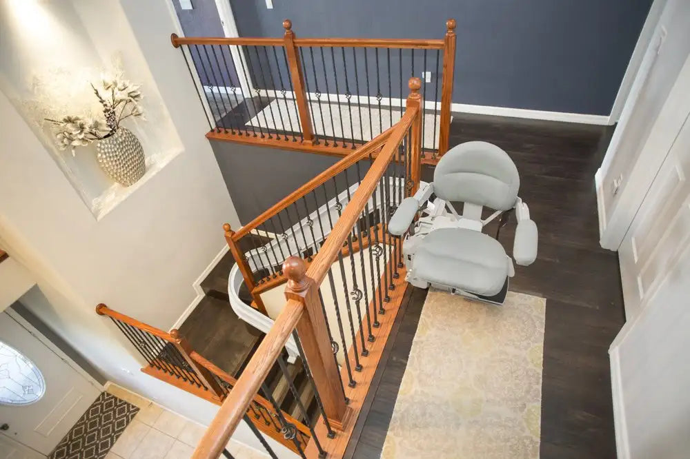 Stairlift on a wooden staircase in a home interior.